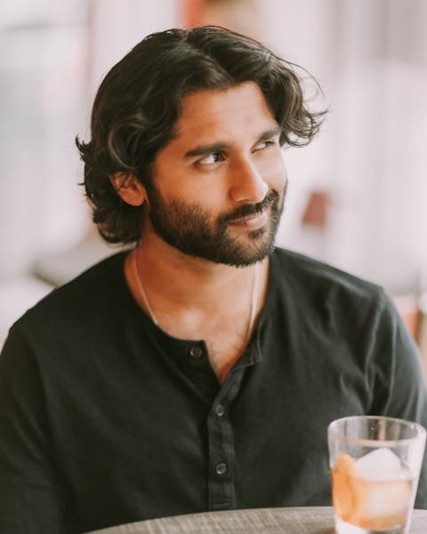 Man holding camera facing forward