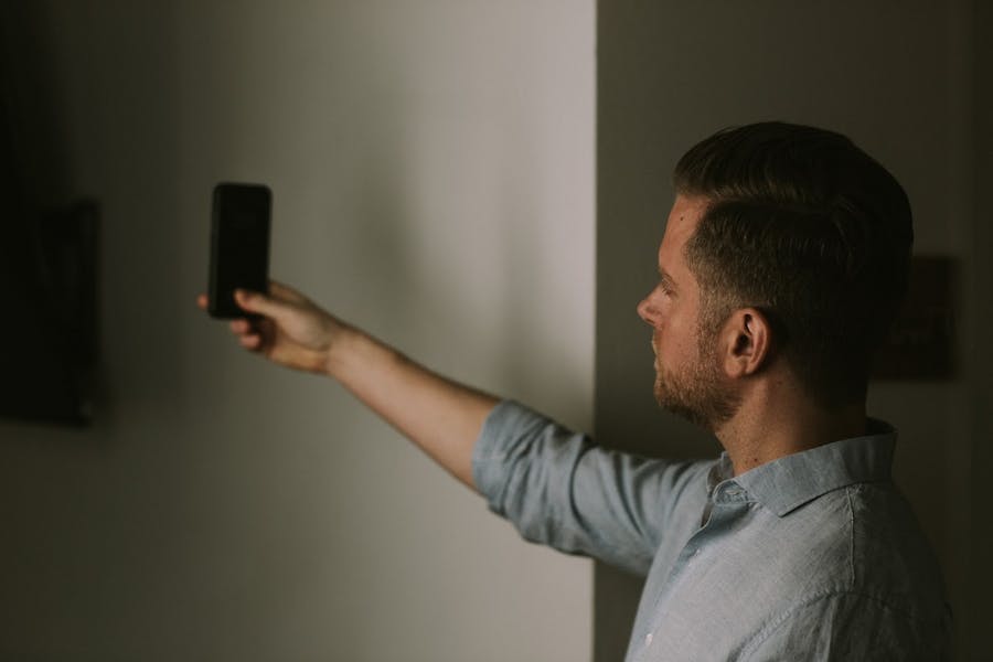 Man holding camera facing forward